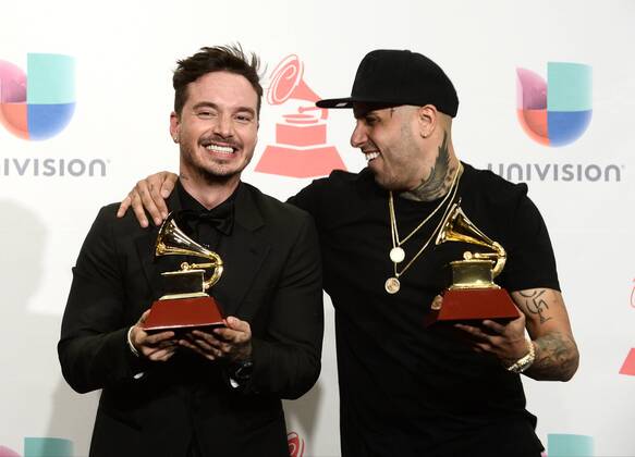 J Balvin, left, with the award for Best Urban Song for Ay Vamos and Nicky Jam, with the award for Best Urban Performance for El Perdon pose in the pressroom during the 16th Annual Latin Grammy Awards at the MGM Grand Garden Arena in Las Vegas, Nevada on November 19, 2015.  LAV20151119621 JIMxRUYMEN