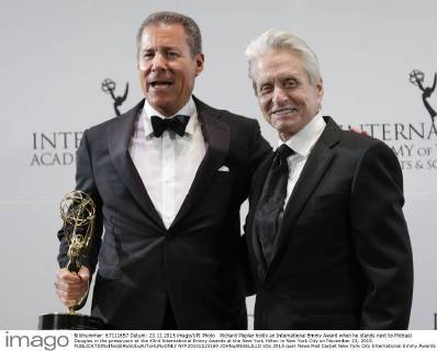 Richard Plepler holds an International Emmy Award when he stands next to Michael Douglas in the pressroom at the 43rd International Emmy Awards at the New York Hilton in New York City on November 23, 2015.  NYP20151123169 JOHNxANGELILLO