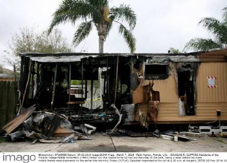 March 7, 2014 - Palm Harbor, Florida, U.S. - DOUGLAS R. CLIFFORD.Residents of the Frontier Village Mobile Home Park in Palm Harbor say this mobile home burned last Saturday at the park, nearly a week before two more mobile homes were discovered on fire earlier this morning (Friday (3 7 14). Deputies responded to the call at 2:30 a.m. at the park, 30700 US Hwy 19 lot 103, and found a mobile home engulfed in flames. A neighbor helped evacuate the two residents inside, Animal Kidd, 65, and Marcus DeVoto, 63, who were both treated for smoke inhalation, according to deputies. While Palm Harbor Fire Rescue was extinguishing the fire at lot 103, another smaller fire was discovered at lot 80 and was quickly extinguished. The lot was vacant and no injuries were reported. - ZUMAs70