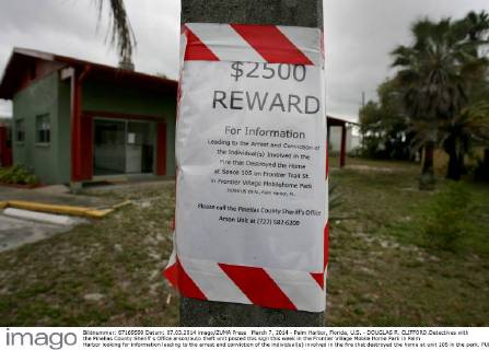 March 7, 2014 - Palm Harbor, Florida, U.S. - DOUGLAS R. CLIFFORD.Detectives with the Pinellas County Sheriff s Office arson auto theft unit posted this sign this week in the Frontier Village Mobile Home Park in Palm Harbor looking for information leading to the arrest and conviction of the individual(s) involved in the fire that destroyed the home at unit 105 in the park. - ZUMAs70
