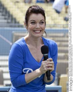 April 7, 2013 - Los Angeles, California, U.S - Actress BELLAMY YOUNG prepares to sing the National Anthem during pre game festivities before the Los Angeles Dodgers play the Pittsburgh Pirates at Dodgers Stadium. - ZUMAp12