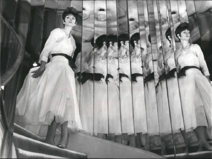 IMAGO ICONS: Coco Chanel 1963 - Great Couturiers present their spring summer fashion; A Glimpse of Coco Chanel s new 1963 line; Photo Shows Evening dress of white organdi and red belt obligatory mention creation chanel immediate diffusion. - ZUMAk09_