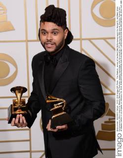 The Weeknd, winner of the Best R&B Performance award for Earned It, and Best Urban Contemporary Album award for Beauty Behind The Madness, appears backstage with the award for XXX during the 58th annual Grammy Awards held at Staples Center in Los Angeles on February 15, 2016.  LAP201602151038 PHILxMCCARTEN