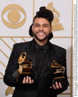 The Weeknd, winner of the Best R&B Performance award for Earned It, and Best Urban Contemporary Album award for Beauty Behind The Madness, appears backstage with the award for XXX during the 58th annual Grammy Awards held at Staples Center in Los Angeles on February 15, 2016.  LAP201602151044 PHILxMCCARTEN