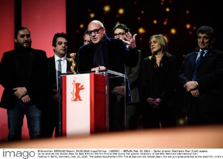 (160220) -- BERLIN, Feb. 20, 2016 -- Italian director Gianfranco Rosi (front) speaks as he receives the Golden Bear for Best Film for the film Fire at Sea during the awards ceremony of the 66th Berlinale International Film Festival in Berlin, Germany, Feb. 20, 2016. The Italian documentary film Fire at Sea won the Golden Bear, the top jury prize awarded to the best film, in the 66th Berlin International Film Festival on Saturday. ) GERMANY-BERLIN-BERLINALE INTERNATIONAL FILM FESTIVAL-AWARDS CEREMONY-GOLD BEAR-GIANFRANCO ROSI ZhangxFan 
