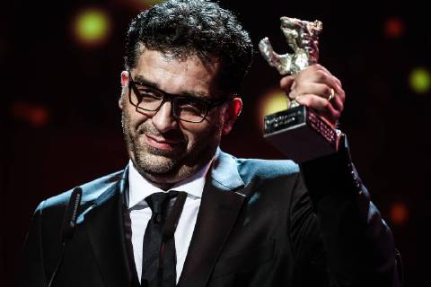 (160220) -- BERLIN, Feb. 20, 2016 -- Bosnian director Danis Tanovic holds the Silver Bear for Grand Jury Prize for the film Smrt u Sarajevu Mort a Sarajevo (Death in Sarajevo) during the awards ceremony of the 66th Berlinale International Film Festival in Berlin, Germany, Feb. 20, 2016. ) GERMANY-BERLIN-BERLINALE INTERNATIONAL FILM FESTIVAL-AWARDS CEREMONY ZhangxFan 