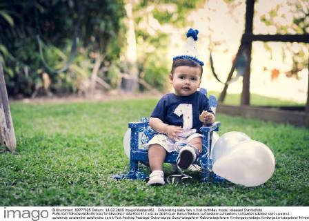 Celebrating baby boy s first birthday model released Symbolfoto  ABAF001973