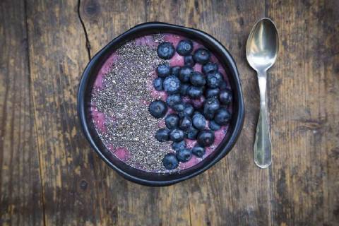 Blueberry smoothie with chia seeds in bowl, fresh blueberries LVF004500