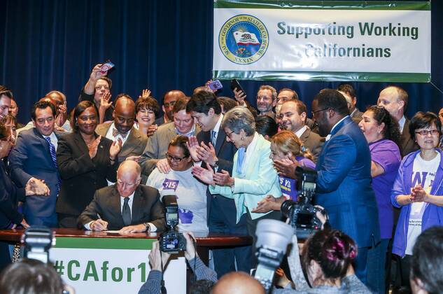 (160404) -- LOS ANGELES, April 4, 2016 -- California Governor Jerry Brown signs landmark legislation SB 3 into law in Los Angeles, California, the United States, on April 4, 2016. Lawmakers in California on Thursday approved of raising minimum wage to 15 dollars an hour by 2022, making the state the first to mandate such a pay hike. ) U.S.-CALIFORNIA-LOS ANGELES-MINIMUM WAGE-LEGISLATION ZhaoxHanrong 
