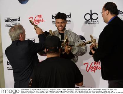 Singer The Weeknd appears backstage with his 8 Awards for Top Hot 100 Artist, Top Song Sales Artist, Top Radio Songs Artist, Top Streaming Songs Artist, Top R&B Artist, Top R&B Album, Tom Streaming Song (Audio) and Top R&B Song during the annual Billboard Music Awards held at T-Mobile Arena in Las Vegas, Nevada on May 22, 2016.  LAV20160522164 JIMxRUYMEN