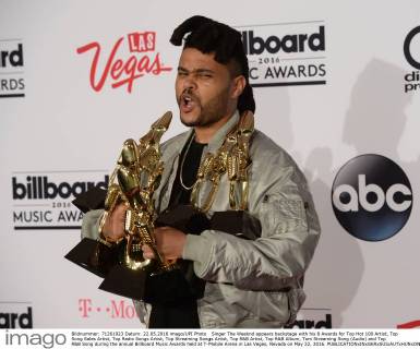 Singer The Weeknd appears backstage with his 8 Awards for Top Hot 100 Artist, Top Song Sales Artist, Top Radio Songs Artist, Top Streaming Songs Artist, Top R&B Artist, Top R&B Album, Tom Streaming Song (Audio) and Top R&B Song during the annual Billboard Music Awards held at T-Mobile Arena in Las Vegas, Nevada on May 22, 2016.  LAV20160522169 JIMxRUYMEN