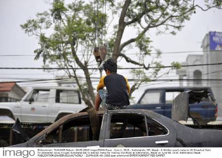 June 4, 2016 - Kathmandu, NP, Nepal - A Worker await crane to lift Smashed Card for dismental using Oxygen Acetylene Gas to extract metal for making Iron Rods at Kathmandu, Nepal on June 04, 2016. Kathmandu Nepal  - ZUMAn230
