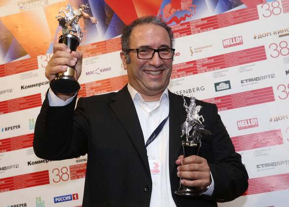 MOSCOW, RUSSIA - JUNE 30, 2016: Director Reza Mirkarimi with the Golden George award main prize for the best film for his film Daughter at the closing of the 38th Moscow International Film Festival. Vyacheslav Prokofyev TASS  TS02887A
