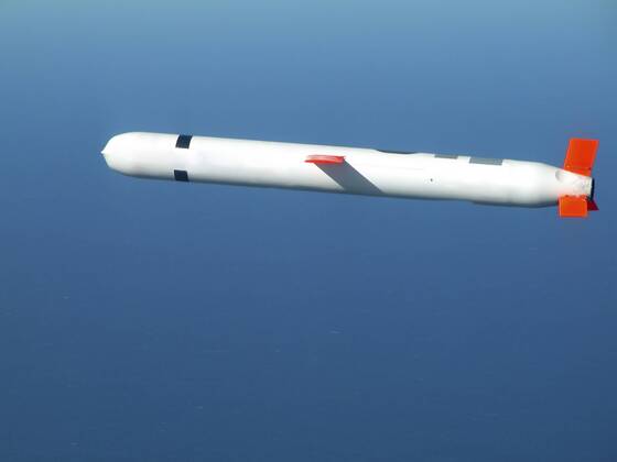 China Lake, California, November 10, 2002 - A Tactical Tomahawk Block IV cruise missile conducts a controlled flight test over the Naval Air Systems Command (NAVAIR) western test range complex in southern California. The Tactical Tomahawk, the next generation of Tomahawk cruise missile, adds the capability to reprogram the missile while in-flight to strike any of 15 preprogrammed alternate targets, or redirect the missile to any Global Positioning System (GPS) target coordinates. It also will be able to loiter over a target area for some hours, and with its on-board TV camera, will allow the war fighting commanders to assess battle damage of the target, and, if necessary redirect the missile to any other target.  Copyright: StocktrekxImages stk103041m