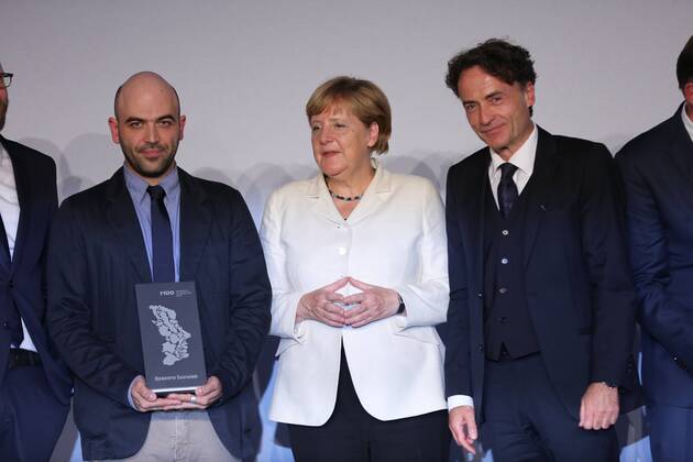 Presentation of the M100 Media Prize in Potsdam The presentation of the M100 Media Prize in the Orangery Palace in Potsdam was attended by Chancellor Dr. Angela Merkel, Roberto Saviano, author ( Gomorrah ), journalist and M100 Media Award winners 2016 Giobanni di Lorenzo, editor in chief, Die Zeit and Jann Jakobs, Lord Mayor of Landeshauptstad Potsdam.  SimonexKuhlmey