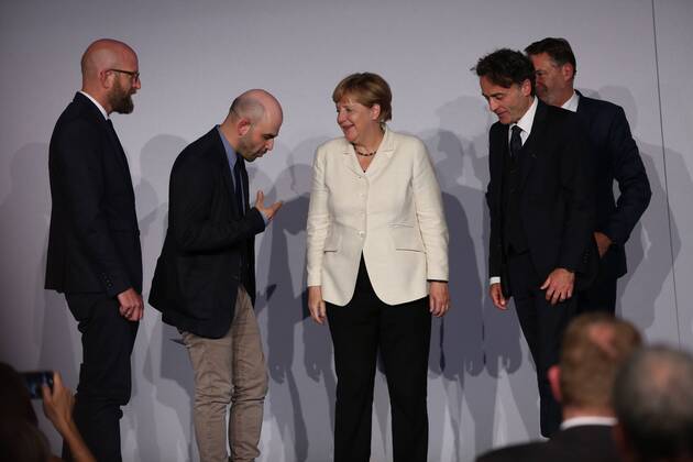 Presentation of the M100 Media Prize in Potsdam The presentation of the M100 Media Prize in the Orangery Palace in Potsdam was attended by Chancellor Dr. Angela Merkel, Roberto Saviano, author ( Gomorrah ), journalist and M100 Media Award winners 2016 Giobanni di Lorenzo, editor in chief, Die Zeit and Jann Jakobs, Lord Mayor of Landeshauptstad Potsdam.  SimonexKuhlmey