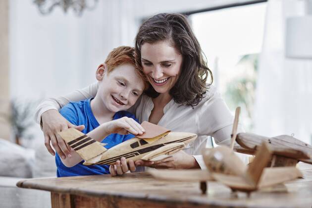Mother and son with model airplanes model released Symbolfoto property released  RORF00332