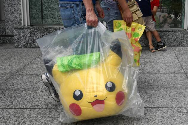 Aug. 01, 2009 - Tokyo, Japan - Pokemon center of Tokyo is big attraction for Japanese children on summer vacation. Fathers put on a hat of popular character Pikachu, Children run around with giant Pokemons grace the walls. For fans of the beloved Pok mon Mystery Dungeon video game series, this fall promises to be an especially thrilling one. - ZUMAy06_ 20090801_jab_y06_928