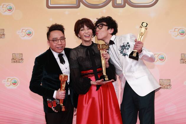 HONG KONG, CHINA - DECEMBER 18: Host Do Do Carol Cheng (C) celebrates with partners hip-hop group FAMA at the backstage of the 2016 TVB Anniversary Awards on December 18, 2016 in Hong Kong, China.  CFP497275749
