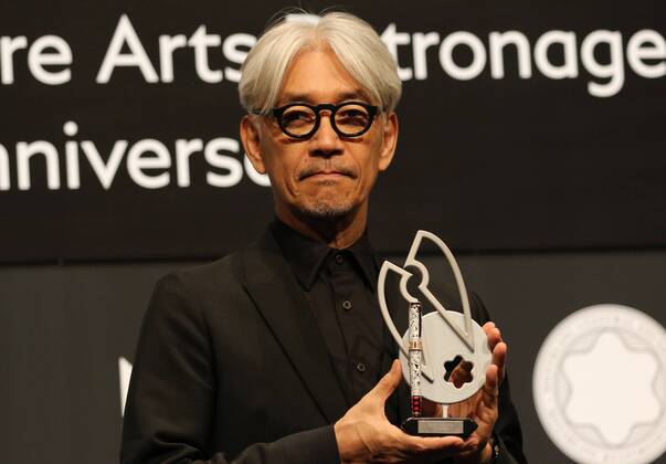 December 21, 2016, Tokyo, Japan - Japanese composer Ryuichi Sakamoto, a member of the Yellow Magic Orchestra (YMO) displays a special fountain pen after he received Montblanc de la Culture Arts Patronage Award in Tokyo on Wednesday, December 21, 2016. Sakamoto played his screen music Merry Christmas Mr. Lawrence with young musicians.  (lwxa006999)