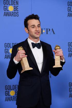 Jan 8, 2017 - Beverly Hills, California, U.S - After winning the categories of BEST ORIGINAL SCORE and BEST ORIGINAL SONG MOTION PICTURE for La La Land, JUSTIN HURWITZ poses with the awards backstage in the press room at the 74th Annual Golden Globe Awards at the Beverly Hilton in Beverly Hills, CA on Sunday, January 8, 2017. Beverly Hills U.S - ZUMAz03_ 20170108_sha_z03_478