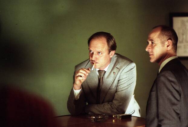 RELEASE DATE: February 9, 2007. MOVIE TITLE: Das Leben der Anderen (North America: The Lives of Others ) - STUDIO: Creado Film Sony Pictures Classics. PLOT: Captain Wiesler (Muhe) is a wiretapping expert with the Stasi (East German Secret Police) in the mid-eighties,who becomes disillusioned with his career and life in general in the former socialist republic when his latest assignment, Georg Dreyman (Koch), a playwright with views against the totalitarian state, starts to challenge his beliefs through his overheard conversations. PICTURED: ULRICH TUKUR as Oberstleutnant Anton Grubitz and ULRICH MUHE as Hauptmann Gerd Wiesler. - ZUMAg90_ 20070209_ddn_g90_484