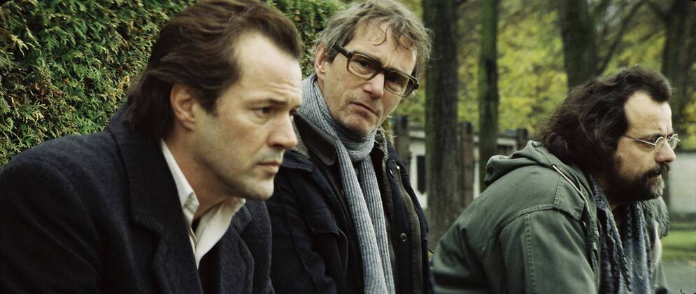 RELEASE DATE: February 9, 2007. MOVIE TITLE: Das Leben der Anderen (North America: The Lives of Others ) - STUDIO: Creado Film Sony Pictures Classics. PLOT: Captain Wiesler (Muhe) is a wiretapping expert with the Stasi (East German Secret Police) in the mid-eighties,who becomes disillusioned with his career and life in general in the former socialist republic when his latest assignment, Georg Dreyman (Koch), a playwright with views against the totalitarian state, starts to challenge his beliefs through his overheard conversations. PICTURED: SEBASTIAN KOCH (far left) as Georg Dreyman. - ZUMAg90_ 20070209_ddn_g90_497