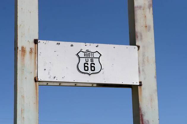 Sep 24, 2006; Amboy, CA, USA; U.S. Route 66 (also known as Route 66 or Will Rogers Highway) was a highway in the U.S. Highway system. One of the original federal routes, US 66 was established on November 11, 1926, though signs did not go up until the following year. It originally ran from Chicago, Illinois through St. Louis, Missouri, Kansas, Oklahoma, Texas, New Mexico, Arizona and California before ending at Los Angeles for a total of 2,448 miles (3,939 km). Route 66 underwent many improvements and realignments. One of those resulted in the movement of the endpoint from Los Angeles to Santa Monica. Contrary to common belief, Route 66 never ran to the ocean; it terminated onto what was then US-101, at the intersection of what is today Lincoln Boulevard and Olympic Boulevard. Route 66 was a major migratory path west, especially during the Dust Bowl of the 1930s, and supported the economi - ZUMAm69_ 20060924_mdm_m69_119