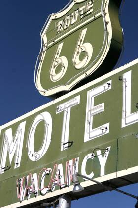 Sep 24, 2006; Barstow, CA, USA; U.S. Route 66 (also known as Route 66 or Will Rogers Highway) was a highway in the U.S. Highway system. One of the original federal routes, US 66 was established on November 11, 1926, though signs did not go up until the following year. It originally ran from Chicago, Illinois through St. Louis, Missouri, Kansas, Oklahoma, Texas, New Mexico, Arizona and California before ending at Los Angeles for a total of 2,448 miles (3,939 km). Route 66 underwent many improvements and realignments. One of those resulted in the movement of the endpoint from Los Angeles to Santa Monica. Contrary to common belief, Route 66 never ran to the ocean; it terminated onto what was then US-101, at the intersection of what is today Lincoln Boulevard and Olympic Boulevard. Route 66 was a major migratory path west, especially during the Dust Bowl of the 1930s, and supported the econo - ZUMAm69_ 20060924_mdm_m69_123