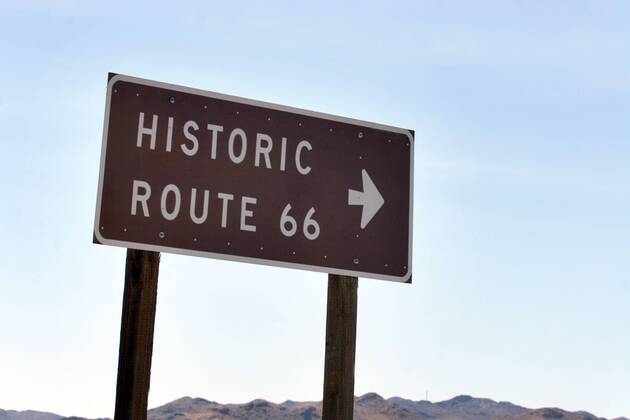 Sep 24, 2006; Barstow, CA, USA; U.S. Route 66 (also known as Route 66 or Will Rogers Highway) was a highway in the U.S. Highway system. One of the original federal routes, US 66 was established on November 11, 1926, though signs did not go up until the following year. It originally ran from Chicago, Illinois through St. Louis, Missouri, Kansas, Oklahoma, Texas, New Mexico, Arizona and California before ending at Los Angeles for a total of 2,448 miles (3,939 km). Route 66 underwent many improvements and realignments. One of those resulted in the movement of the endpoint from Los Angeles to Santa Monica. Contrary to common belief, Route 66 never ran to the ocean; it terminated onto what was then US-101, at the intersection of what is today Lincoln Boulevard and Olympic Boulevard. Route 66 was a major migratory path west, especially during the Dust Bowl of the 1930s, and supported the econo - ZUMAm69_ 20060924_mdm_m69_125