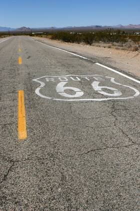 Sep 24, 2006; Goffs, CA, USA; U.S. Route 66 (also known as Route 66 or Will Rogers Highway) was a highway in the U.S. Highway system. One of the original federal routes, US 66 was established on November 11, 1926, though signs did not go up until the following year. It originally ran from Chicago, Illinois through St. Louis, Missouri, Kansas, Oklahoma, Texas, New Mexico, Arizona and California before ending at Los Angeles for a total of 2,448 miles (3,939 km). Route 66 underwent many improvements and realignments. One of those resulted in the movement of the endpoint from Los Angeles to Santa Monica. Contrary to common belief, Route 66 never ran to the ocean; it terminated onto what was then US-101, at the intersection of what is today Lincoln Boulevard and Olympic Boulevard. Route 66 was a major migratory path west, especially during the Dust Bowl of the 1930s, and supported the economi - ZUMAm69_ 20060924_mdm_m69_137