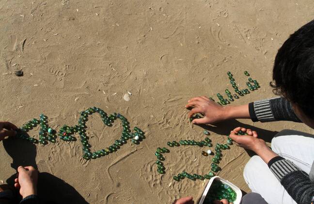 January 19, 2017 - Rafah, Gaza Strip, Palestinian Territory - Palestinian children play marbles in a street in Rafah in the southern Gaza strip on January 19, 2017 Rafah Palestinian Territory - ZUMAap3_ 20170119_zaf_ap3_036