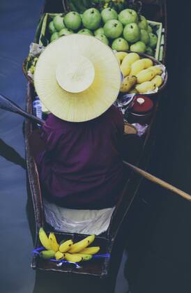 Damnoen Saduak Floating Market, a woman selling goods from boats in floating market Damnoen Saduak Floating Market, a woman selling goods from boats in floating market 27392