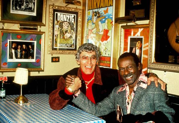 CHUCK BERRY (October 18, 1926 - March 18, 2017) was an American guitarist, singer and songwriter and is one of the pioneers of rock and roll music. With iconic songs such as Maybellene (1955), Roll Over Beethoven (1956), Rock and Roll Music (1957) and Johnny B. Goode (1958), Berry refined and developed rhythm and blues into the major elements that made rock and roll distinctive, with lyrics focusing on teen life and consumerism and music featuring guitar solos and showmanship that were a major influence on subsequent rock music. PICTURED: Rock-n-Roll pioneers CARL PERKINS and CHUCK BERRY in 1994.  - ZUMA 20050114_mda_g49_132 Copyright: xWalterxWeissmanx