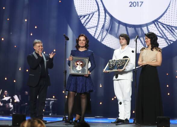 MOSCOW, RUSSIA - APRIL 19, 2017: Russian soprano Nadezhda Pavlova (2nd L) accepts an award for Opera Best Actress for La Traviata, Opera and Ballet Theatre, Perm, from Russian stage director and choreographer Mikhail Kislyarov (L) at the 2017 Golden Mask award ceremony at the Stanislavsky and Nemirovich-Danchenko Moscow Music Theatre. Valery Sharifulin TASS  TS048DF0