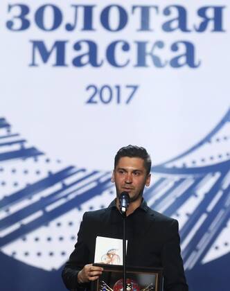 MOSCOW, RUSSIA - APRIL 19, 2017: Russian theatre director Roman Feodori accepts an award for Operetta-Musical Best Director for The Drayman and the King, TYuZ Theatre, Krasnoyarsk, at the 2017 Golden Mask award ceremony at the Stanislavsky and Nemirovich-Danchenko Moscow Music Theatre. Valery Sharifulin TASS  TS048E11