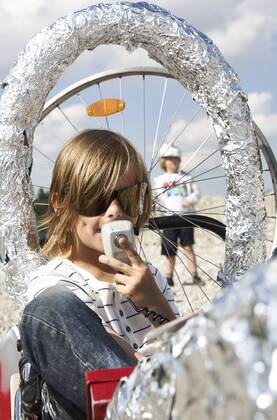 Boy sitting in a self-made rocket playing moon landing model released Symbolfoto  FSF00795