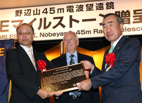 June 14, 2017, Tokyo, Japan - National Astronomical Observatory of Japan (NAOJ) Director General Masahiko Hayashi (L) and Mistubishi Electric president Masaki Sakuyama (R) receive a plaque of Institute of Electrical and Electronics Engineers (IEEE) Milestone award from IEEE president-elect James Jefferies (C) in Tokyo on Wednesday, June 14, 2017. NAOJ s Nobeyama 45-meters radio telescope has been recognized for an IEEE Milestone as the world s largestmillimeter-wave radio telescope to discover a supermassive black hole.  (lwxa011360)