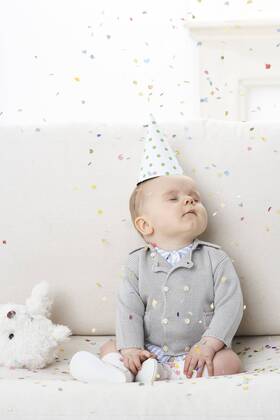 Portrait of baby boy with eyes closed wearing paper hat model released Symbolfoto  FSF00926