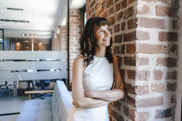 Businesswoman standing in office model released Symbolfoto property released  KNSF02076