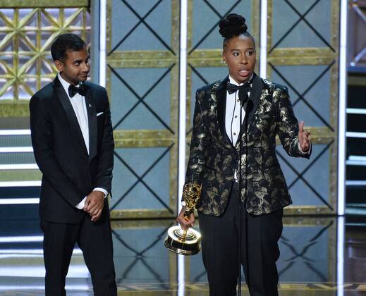 Writers Aziz Ansari (L) and Lena Waithe accept the award for Outstanding Writing for a Comedy Series for Master of None onstage during the 69th annual Primetime Emmy Awards at Microsoft Theater in Los Angeles on September 17, 2017.  LAP201709170187 JIMxRUYMEN