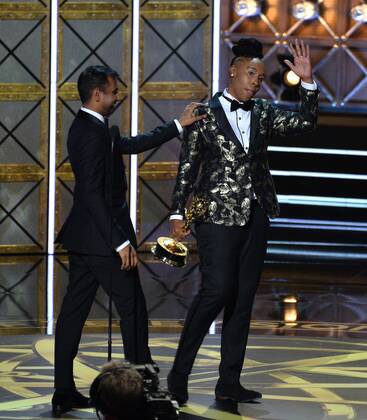 Writers Aziz Ansari (L) and Lena Waithe accept the award for Outstanding Writing for a Comedy Series for Master of None onstage during the 69th annual Primetime Emmy Awards at Microsoft Theater in Los Angeles on September 17, 2017.  LAP201709170191 JIMxRUYMEN