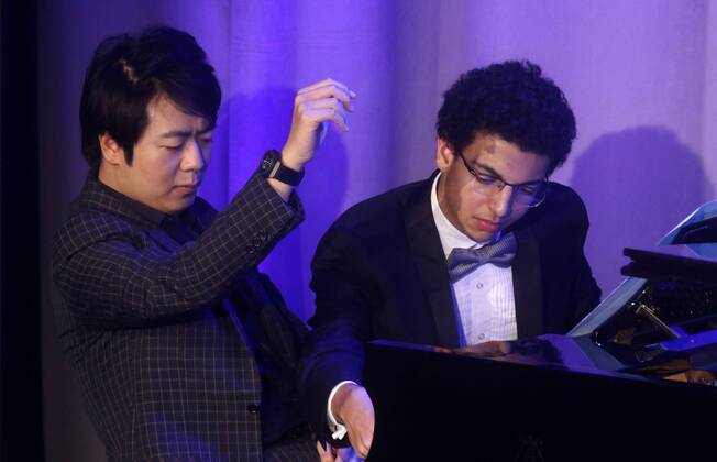 September 19, 2017 - New York, New York, U.S. - Award recipient Chinese pianist LANG LANG and his student AMIR SIRAJ perform at the Atlantic Council 2017 Global Citizen Awards held at the Intrepid Sea, Air, & Space Museum. New York U.S. - ZUMAk03_ 20170919_zaf_k03_122 Copyright: xNancyxKaszermanx