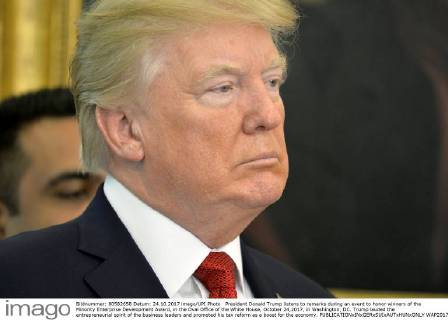 President Donald Trump listens to remarks during an event to honor winners of the Minority Enterprise Development Award, in the Oval Office of the White House, October 24,2017, in Washington, DC. Trump lauded the entrepreneurial spirit of the business leaders and promoted his tax reform as a boost for the economy.  WAP20171024504 MIKExTHEILER