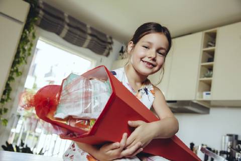 Proud girl holding her school cone model released Symbolfoto property released  MFF03705