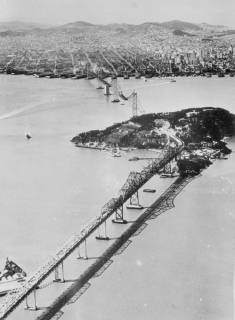 World s longest bridge nears completion . An aerial view of the San Francisco Oakland Bay bridge , which is nearing completion . Yerba Buena Island , through which the bridge is tunnelled , is in centre , and beyond is San Francisco . 16 April 1936, San Francisco California United States of America Copyright: Topfoto  UnitedArchivesEU041927