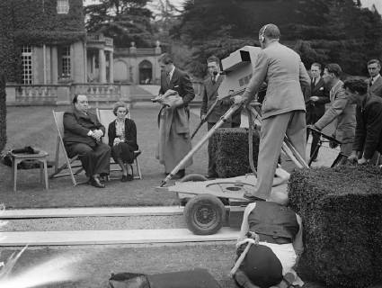 Nova Pilbeam and Alfred Hitchcock being televised and the last programme at Pinewood Studios, Buckinghamshire. BBC engineers had to pit in high-speed work to make the relay possible for television aerial had been blown down in a storm and temporary mast had to be put up. 5 October 1937., United Kingdom England Copyright: Topfoto  UnitedArchivesEU051303