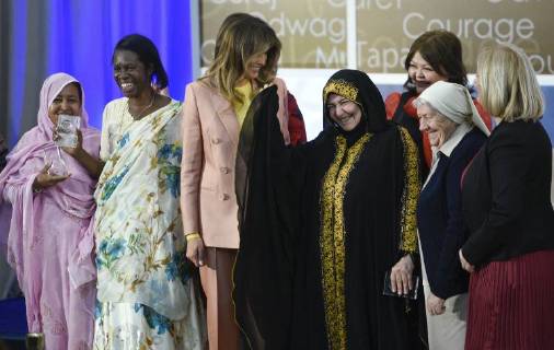 United States First Lady Melania Trump laughs as she stands for a photo with winners of the 2018 International Women of Courage Award, including L Malouma Said of Mauritania, Godelieve Mukasarasi of Rwanda, Dr. Julissa Villanueva of Honduras, Aliyah Khalaf Saleh of Iraq, Aiman Umarova of Kazakhstan, Sister Maria Elena Berini of Italy, and Dr. Fredide Rushdi of Kosovo during the Award Ceremony at the State Department in Washington, DC on March 23, 2018.  WAP20180323905 LEIGHxVOGEL