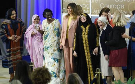 United States First Lady Melania Trump laughs as she stands for a photo with winners of the 2018 International Women of Courage Award, including L Malouma Said of Mauritania, Godelieve Mukasarasi of Rwanda, Dr. Julissa Villanueva of Honduras, Aliyah Khalaf Saleh of Iraq, Aiman Umarova of Kazakhstan, Sister Maria Elena Berini of Italy, Dr. Fredide Rushdi of Kosovo, and Sirikan Charoensiri of Thailand during the Award Ceremony at the State Department in Washington, DC on March 23, 2018.  WAP20180323906