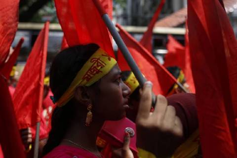 April 30, 2018 - Dhaka, Bangladesh - A garment worker looks on as she attends a procession to mark May Day or International Workers Day in Dhaka. Dhaka Bangladesh - ZUMAh143 20180430_zap_h143_011 Copyright: xMDxMehedixHasanx